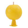 A yellow sticky fruit fly trap ball with a thin stick for pest control.
