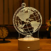 A glowing wireframe globe night light lamp rests on a wooden surface.