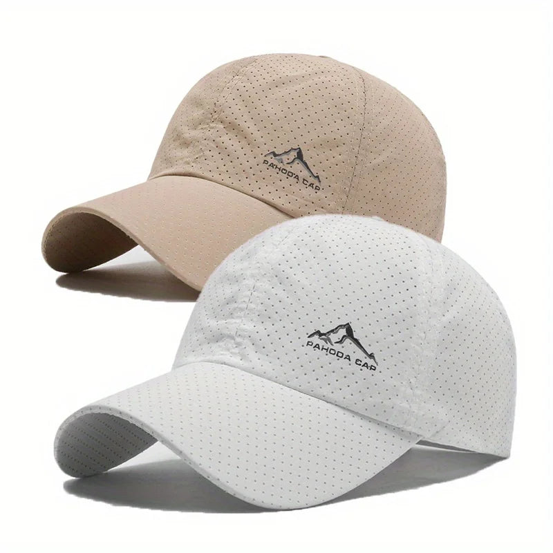 A set of two unisex quick dry baseball caps, one beige and one white, featuring a mountain logo.