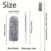 A gray electric duster with a telescopic rod and a fluffy microfiber head shown next to size measurements.