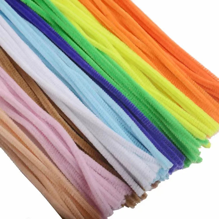 A bundle of colorful chenille craft stems in a rainbow gradient, showing various shades of pink, purple, blue, green, and ora