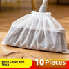 A white disposable broom cover made of mesh material is shown on a wooden surface.