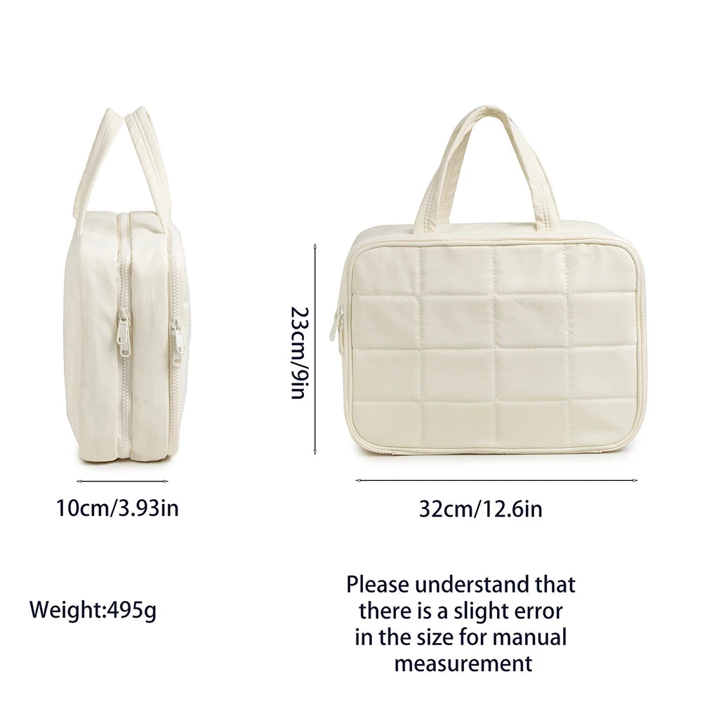 A cream-colored portable hanging toiletry bag with a quilted design shown next to its dimensions.