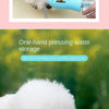 A person is using a blue pet water bottle with food storage to dispense water for a dog.