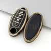 A black and gold TPU car key case cover with a slot for a key and a small fob.