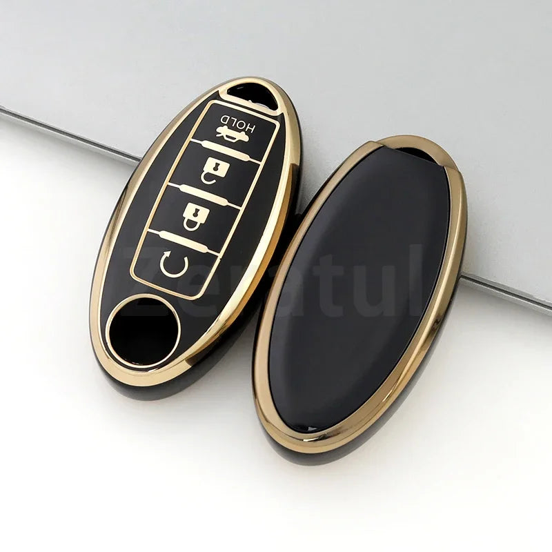A black and gold TPU car key case cover with a slot for a key and a small fob.