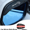 A close-up of an SRT carbon fiber rain brow installed on a car mirror, effectively diverting rainwater.