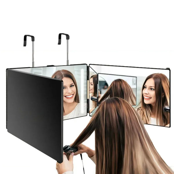 A woman is using a 3-way trifold vanity mirror with an adjustable stand to view her reflection.
