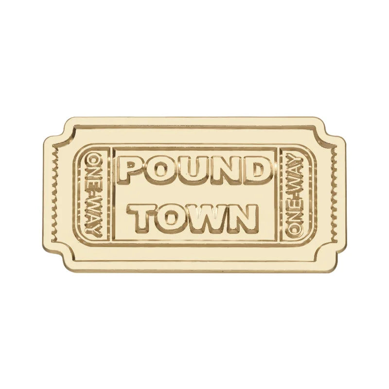Vintage airline ticket enamel brooch featuring the text POUND TOWN
