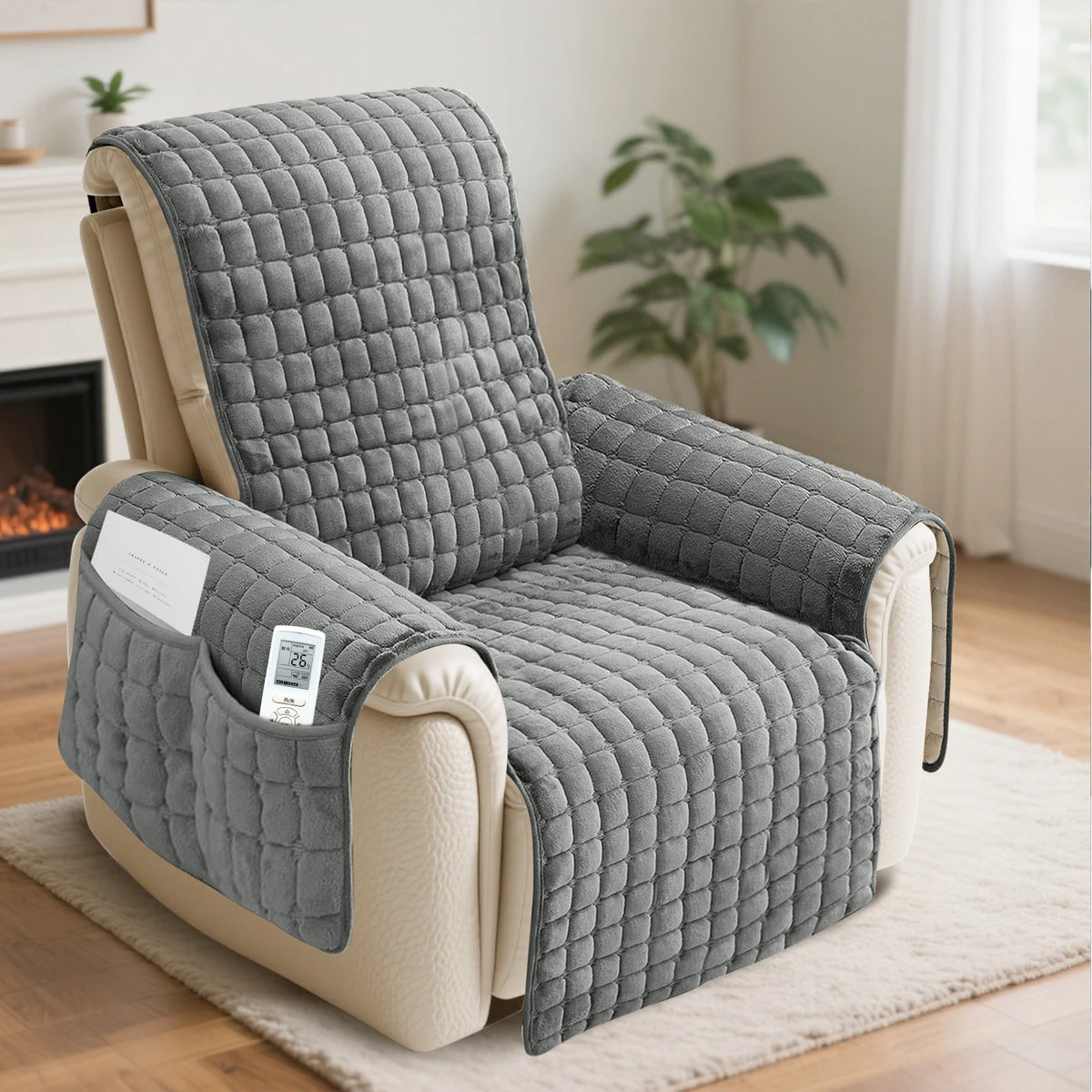 A gray waterproof non-slip recliner sofa cover with side pockets resting on a light rug.