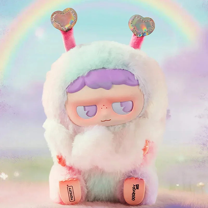 A fluffy, light blue creature with purple hair and large eyes is shown against a rainbow background.