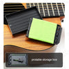 A portable storage box with a bright green microfiber cloth placed on a wooden guitar fretboard.