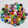 A collection of ten polyhedral dice in various colors and shapes for tabletop role-playing games