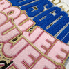 Embroidered God Is Good chenille iron-on patch featuring blue and pink fabric sections