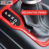 Red decorative frame trim cover for an ABS gear shift panel and cup holder on a Jeep Wrangler or Gladiator.