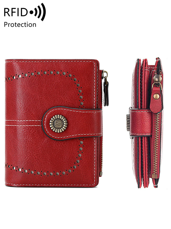 A red leather tri-fold wallet with stitching and a protective RFID blocking feature.