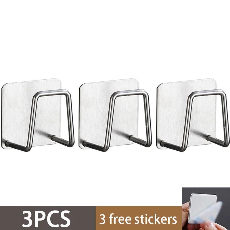 Three stainless steel sponge holders with attached stickers for kitchen sink