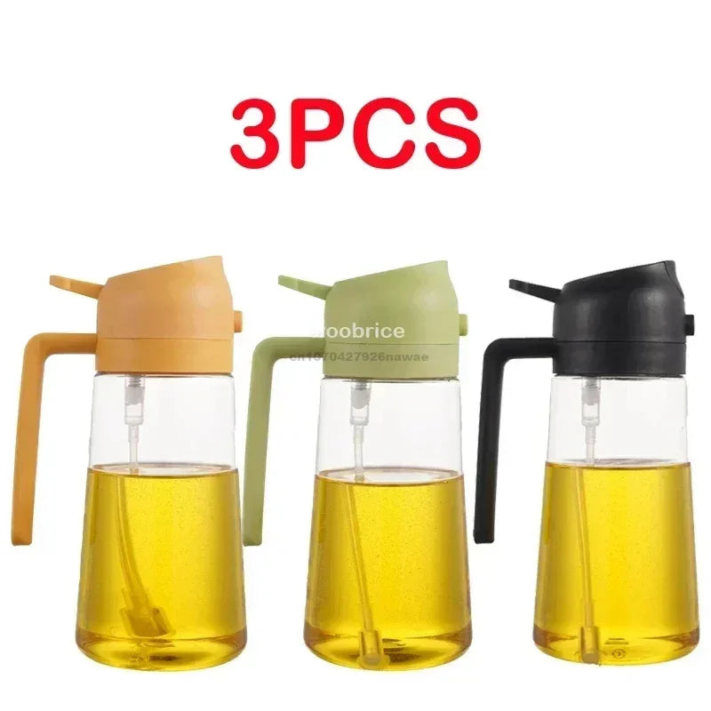 Three glass oil spray bottles in shades of yellow and green for cooking.