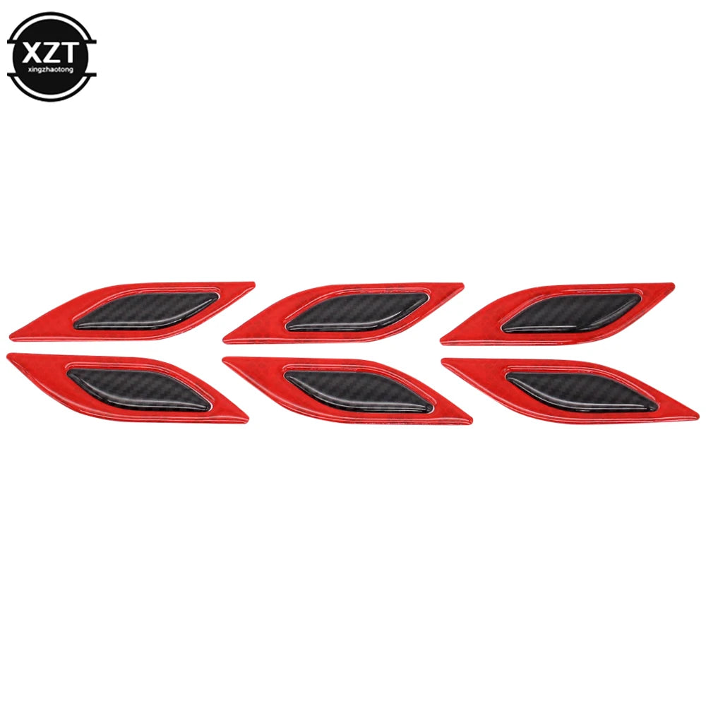 A set of six red reflective carbon fiber car styling strips.
