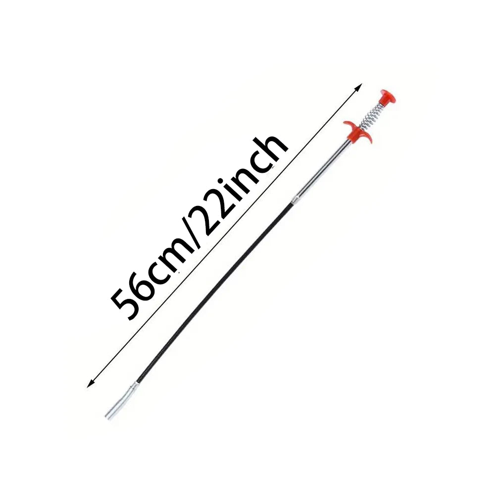 A flexible drain snake with a red handle and black shaft, shown diagonally.