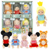 A collection of mini reborn baby dolls with various outfits and accessories displayed in packaging.