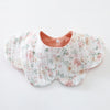 A light pink floral patterned baby feeding bib made of 6-layer cotton.
