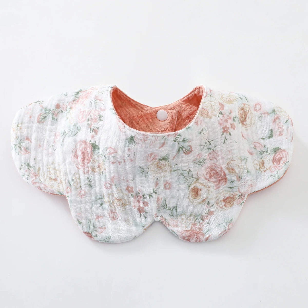 A light pink floral patterned baby feeding bib made of 6-layer cotton.
