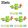 A set of frog balance math learning toys featuring green frogs and red numbers.