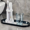 A modern bathroom toothbrush holder with a dust cover and drainage, displayed on a black tray.