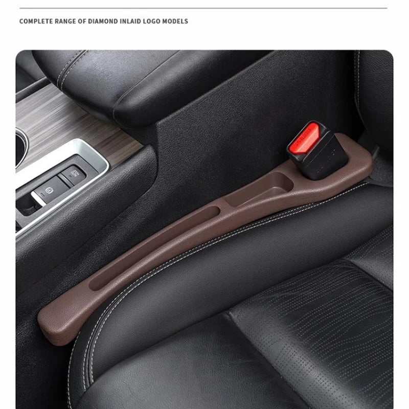 A close-up view of a brown car seat gap plug strip installed in a black car interior, designed to prevent items from slipping