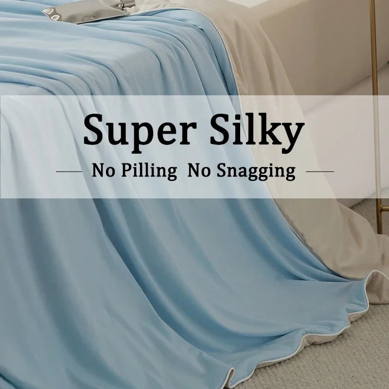 Light blue silky blanket draped over a bed, emphasizing no pilling or snagging.