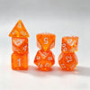 A set of seven translucent orange acrylic polyhedral dice, including a tetrahedron and several dodecahedral dice.