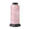A spool of pink heavy-duty nylon sewing thread for upholstery and denim.