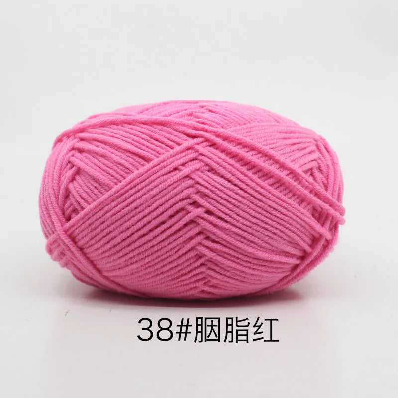 A ball of pink 38-ply yarn used for knitting and crochet