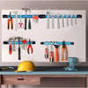 A horizontal magnetic tool holder strip displaying various hand tools like pliers, wrenches, and hammers.