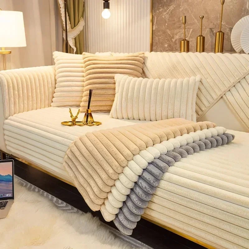 A beige plush sofa cushion mat with layered textures and a gray accent is displayed on a light-colored sofa.
