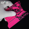 A pink magnetic suede edge squeegee tool is shown next to a white glove.
