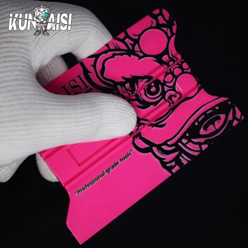 A pink magnetic suede edge squeegee tool is shown next to a white glove.