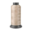 A spool of beige heavy-duty nylon sewing thread for upholstery and denim.