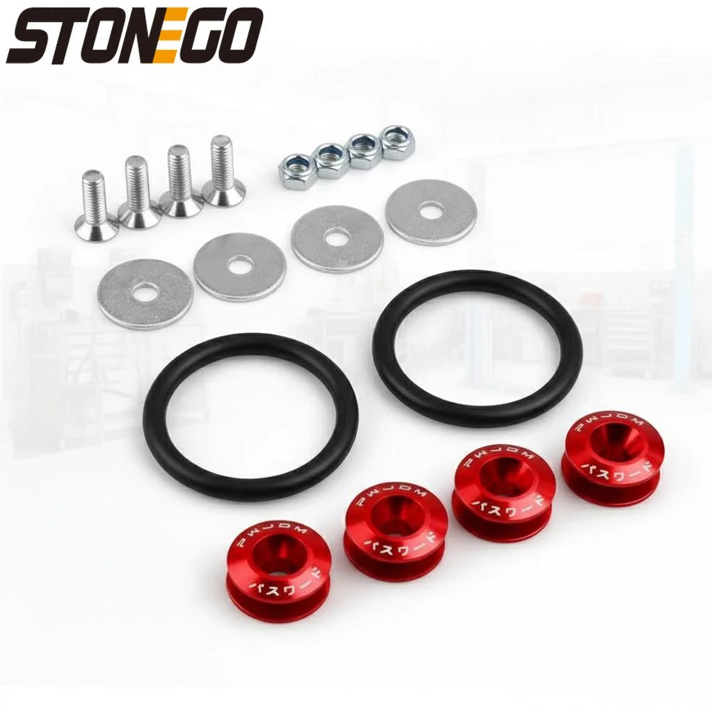 A collection of various metal fasteners and rings for car body panels, including studs, washers, and black rings.