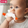 A baby is shown using a white bunny-shaped silicone teeth grinder teether with an orange handle.