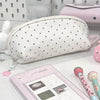 A white polka dot shell-shaped pencil case is shown next to a pink cosmetic bag and a pink pencil case.