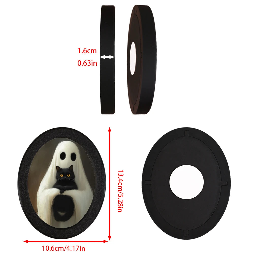 Black oval decorative ornament featuring a gothic ghost and black cat design
