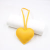Yellow heart-shaped PU leather keychain with a cotton peach charm