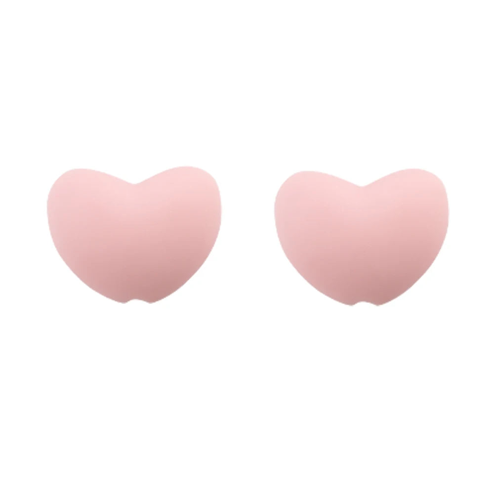 A pair of pink silicone heart beads for DIY jewelry making