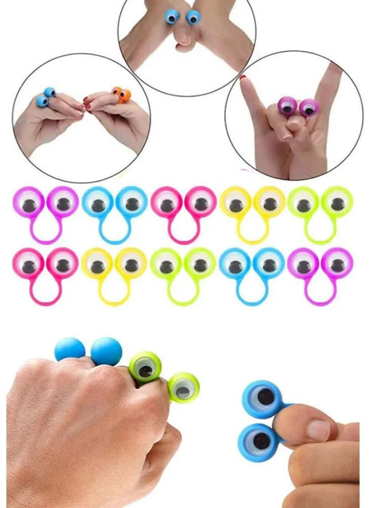 A set of colorful eye finger puppet rings for kids, shown on a hand and in various angles.