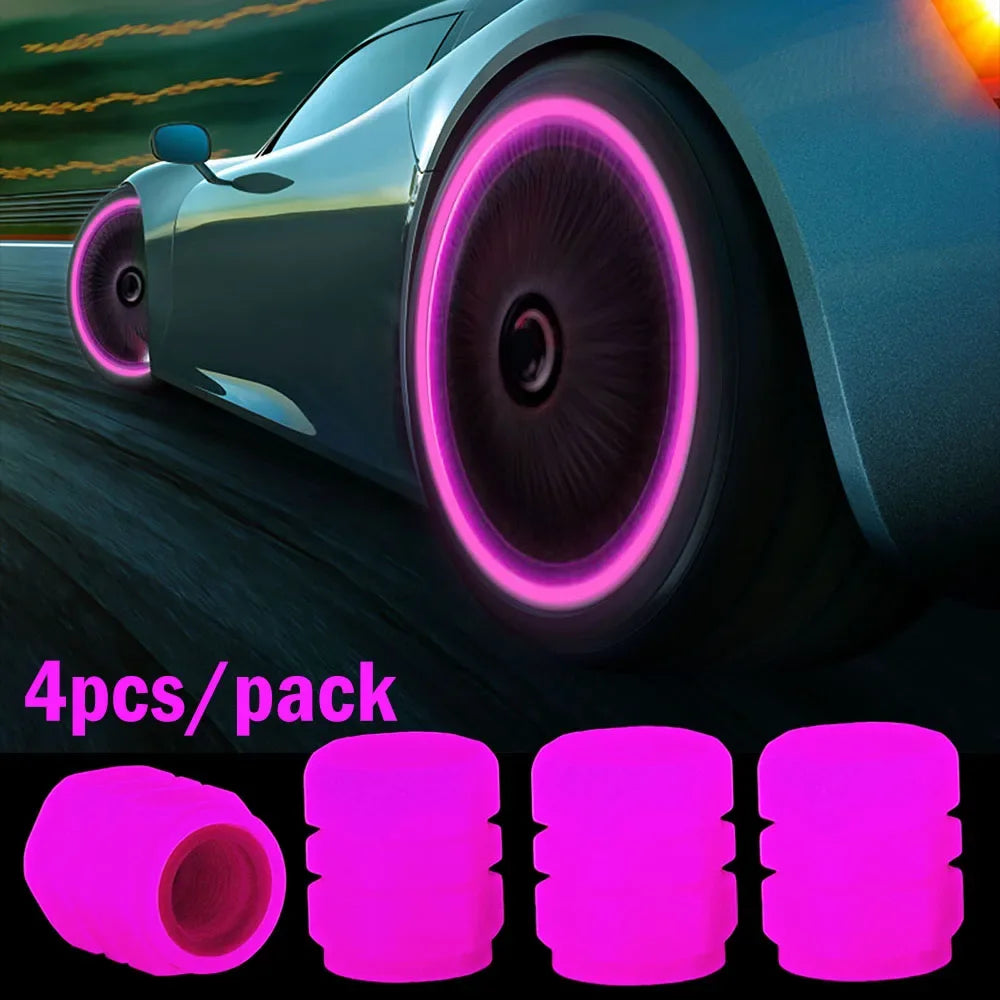 Four luminous pink tire valve caps packaged for automotive use