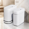 A set of two white, slim rectangular trash cans, one large and one small, shown on a marble surface.