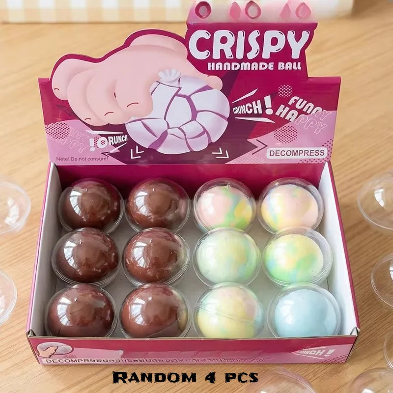 A box of Crispy Handmade Balls containing four soft sensory fidget toys in various colors and textures.