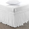 White ruffled elastic bed skirt for a queen or king bed